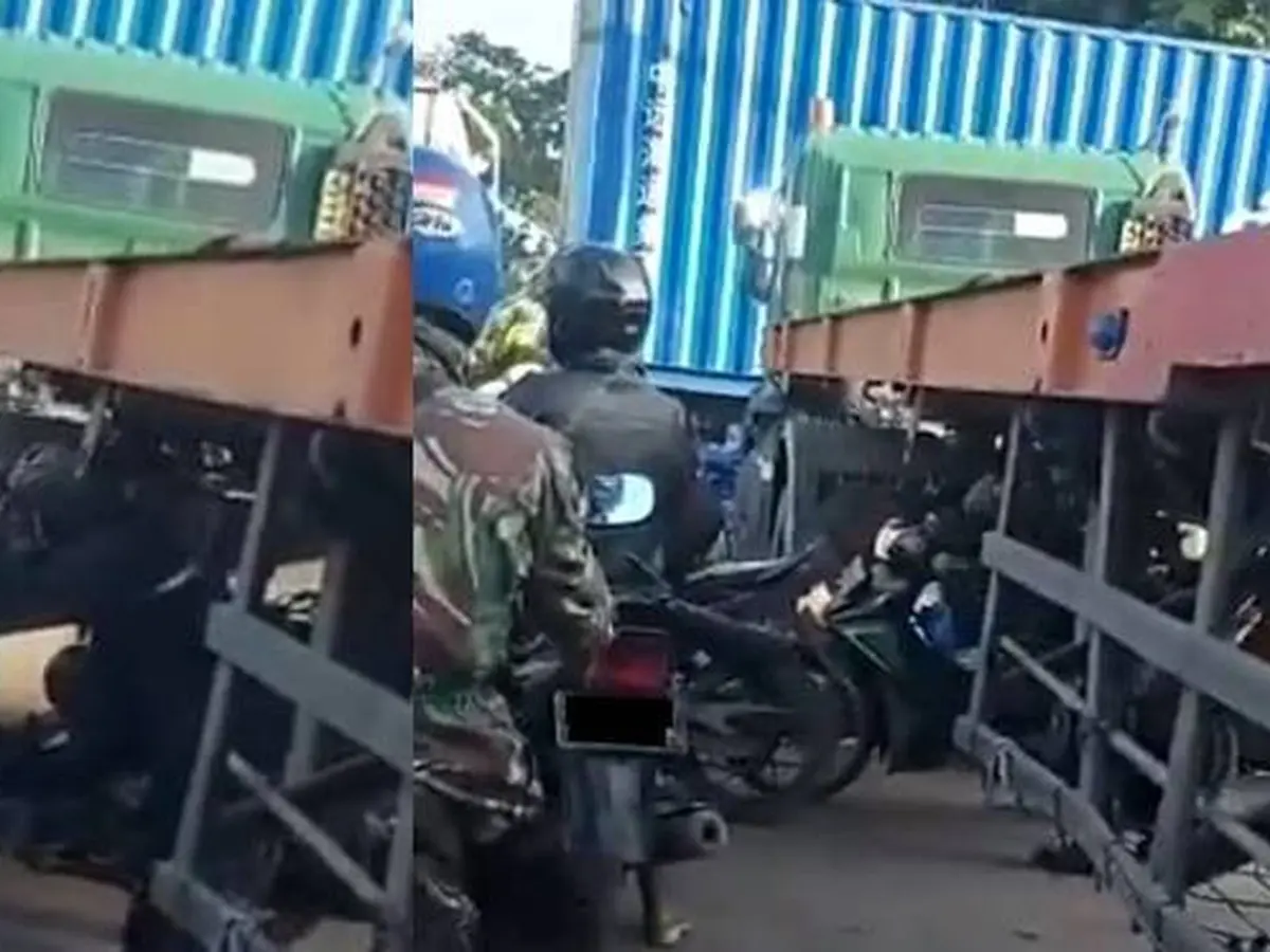 Viral, Aksi Pengendara Motor Lewati Kolong Truk Kontainer Ini Menantang Maut